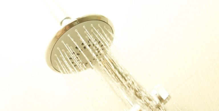 shower head that has a constant stream of water coming from it