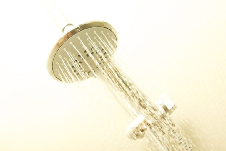 shower head that has a constant stream of water coming from it