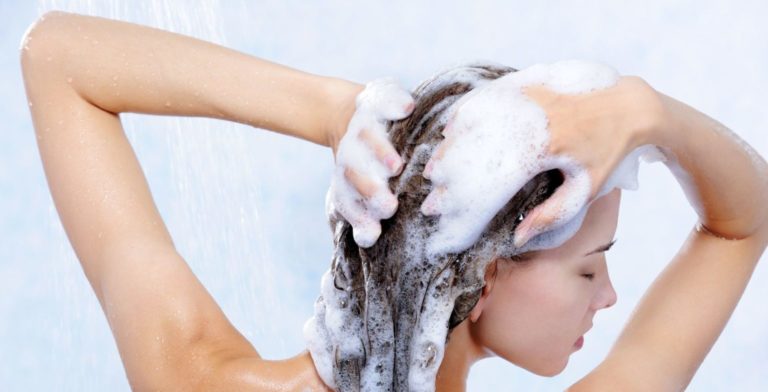 woman using shampoo