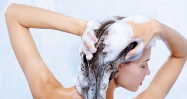 woman using shampoo