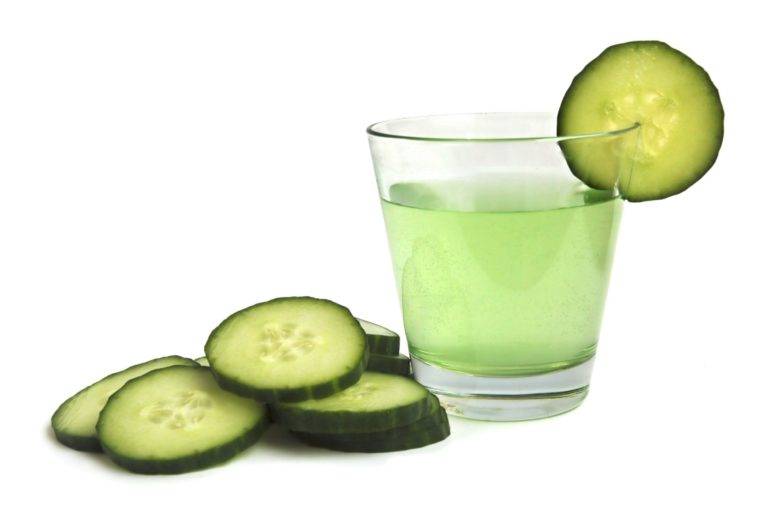 cucumber drink with a cucumber wedge on the glass