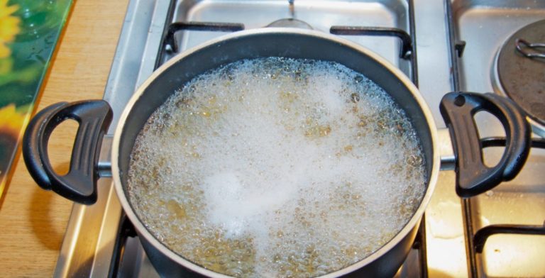 boiling noodles in a cooking pot