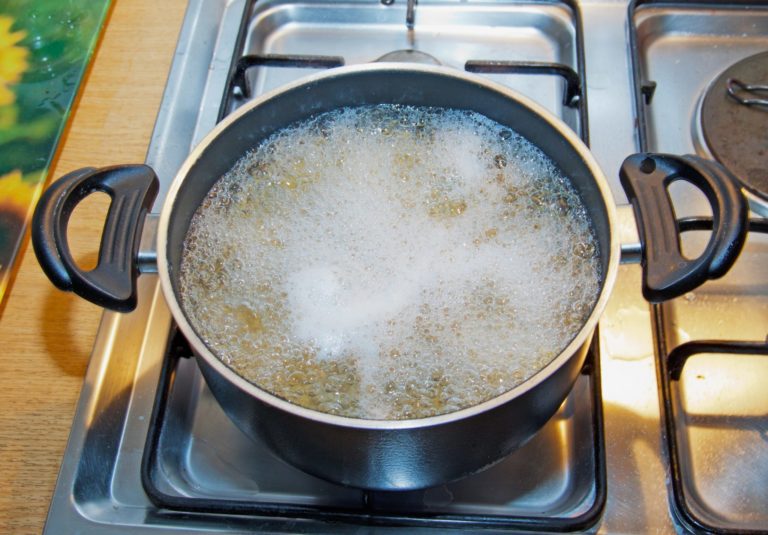 boiling noodles in a cooking pot