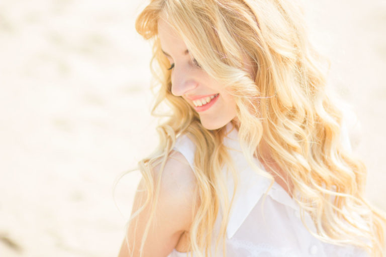 woman that has been using a kinetico water softener to wash her hair and skin