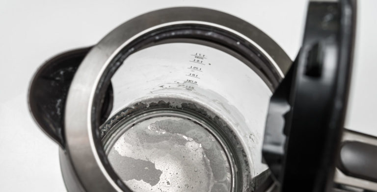 hard water stains left at the bottom of a kettle