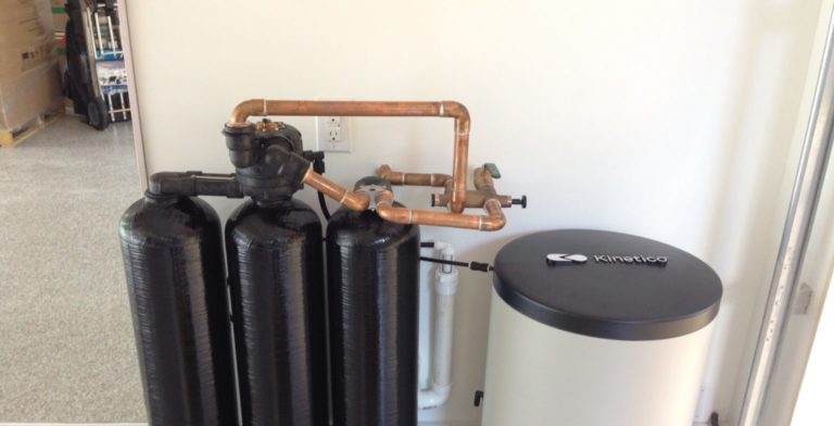 kinetico water softening system that is ready to be installed in a san antonio garage