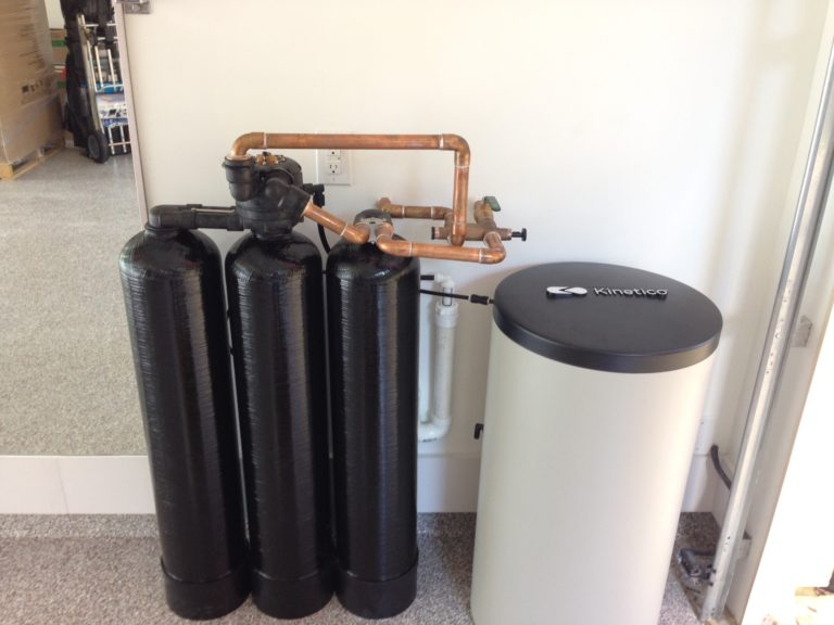 kinetico water softening system that is ready to be installed in a san antonio garage