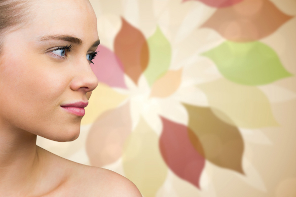 woman looking away with a colorful design in the background