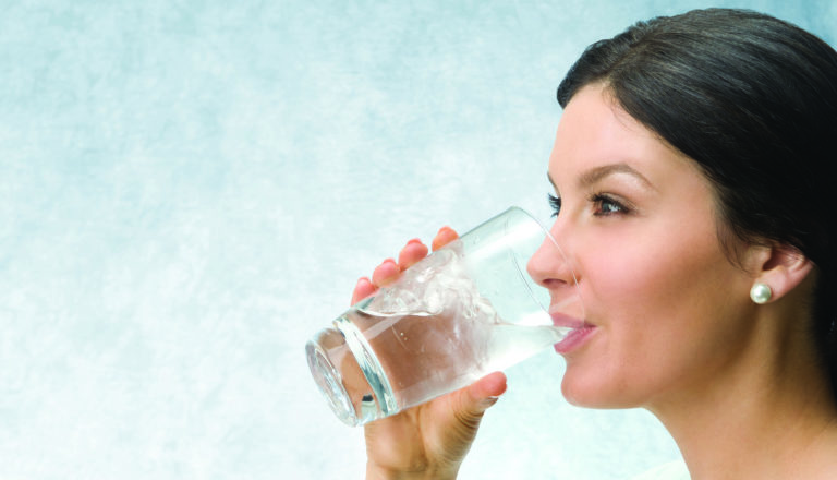 woman drinking purified water