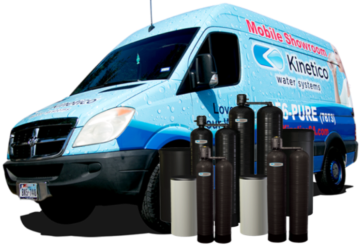 kinetico water systems vehicle posed with their products next to it