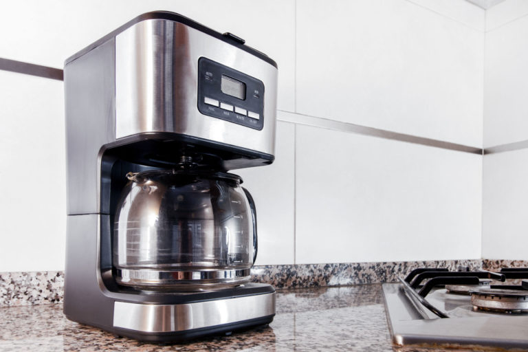 coffee machine placed on a granite counter top