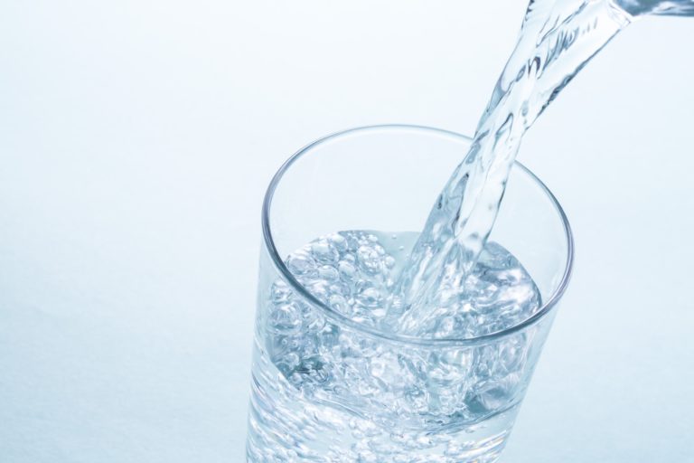 filtered water being poured in cup