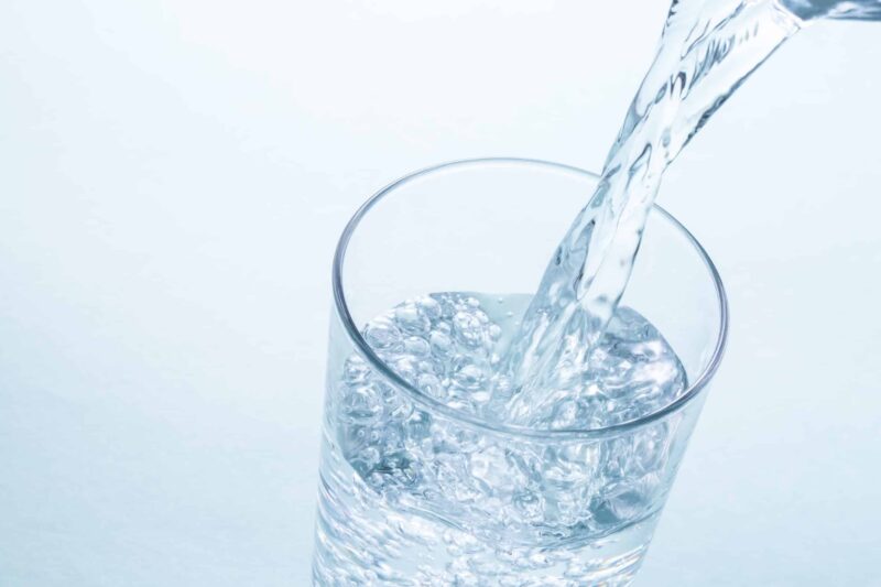 filtered water being poured in cup