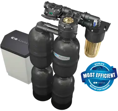 A black water softener system with multiple cylindrical tanks, control valves, and a clear filter, next to a white and black unit. A blue badge reads Worlds Most Efficient Water Softeners.