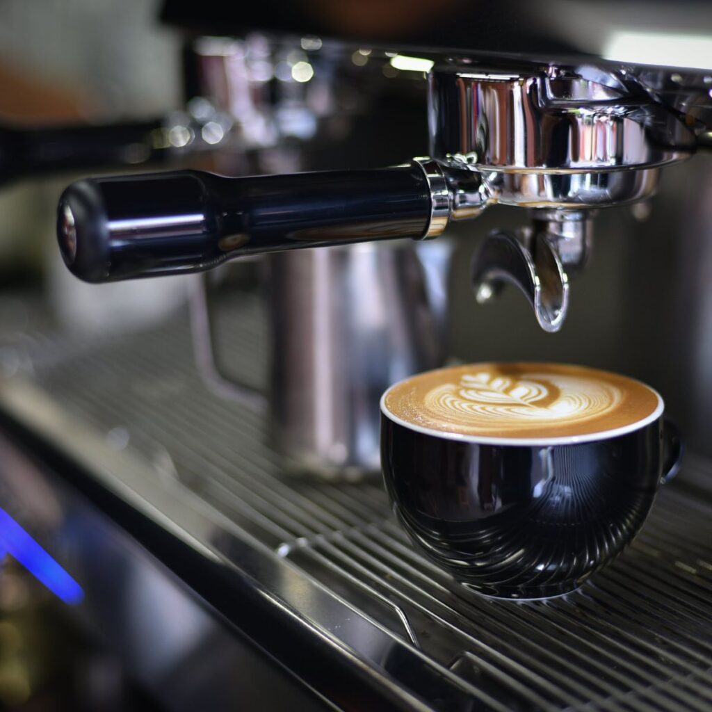coffee under an espresso machine